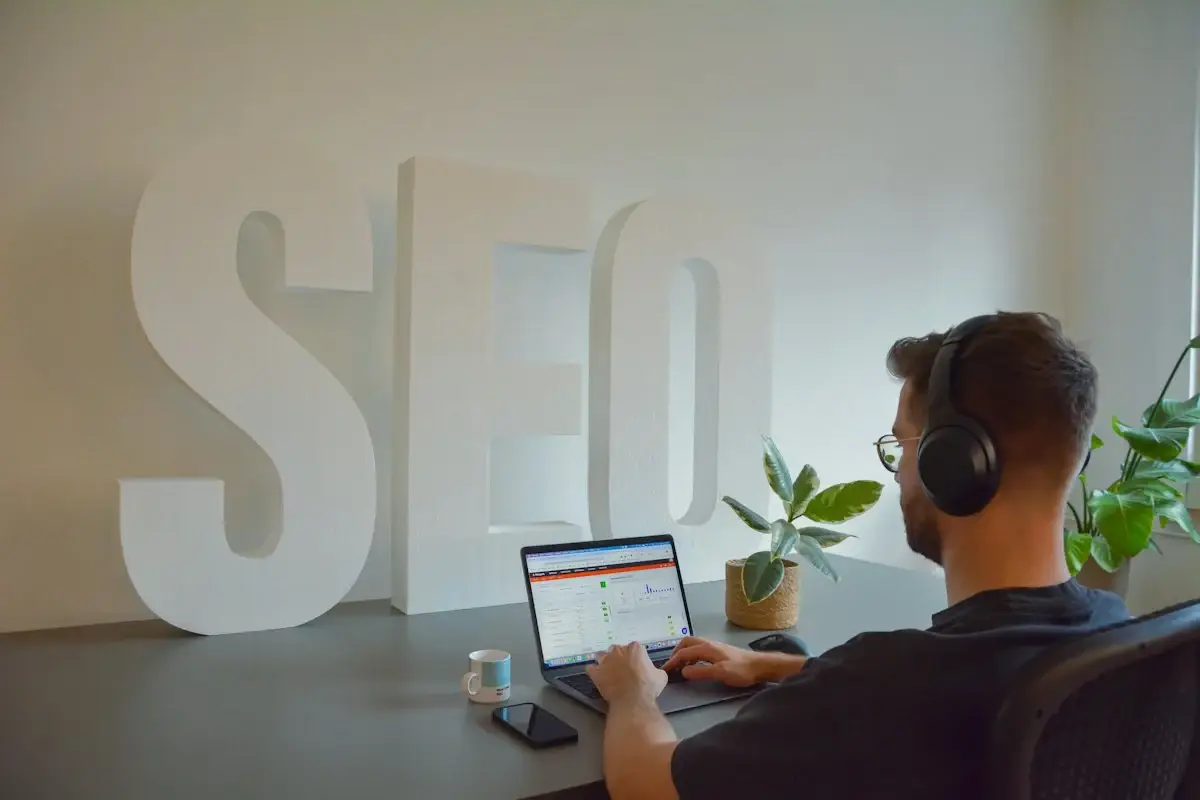 Business owner working on a laptop to improve local search visibility