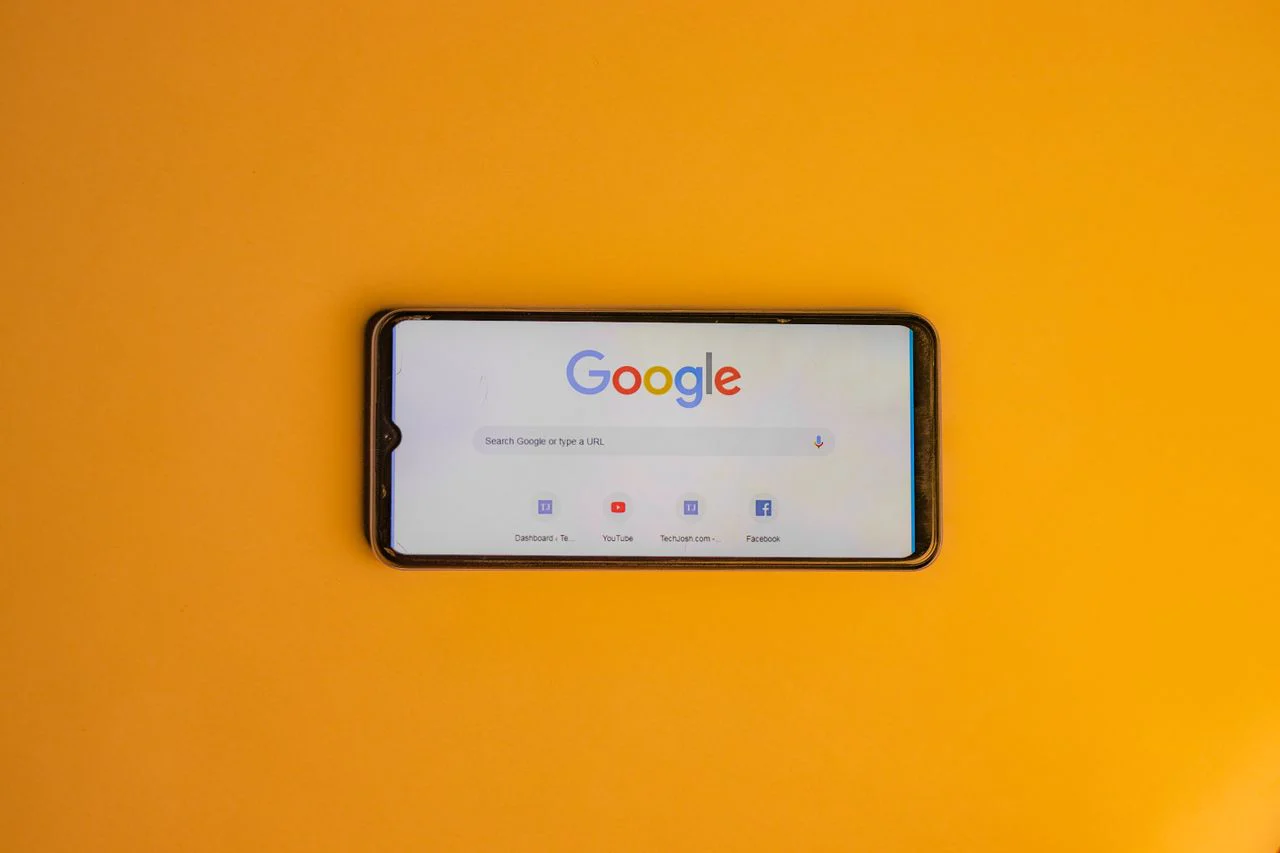 Customer searching Google on a smartphone for an SEO expert near me