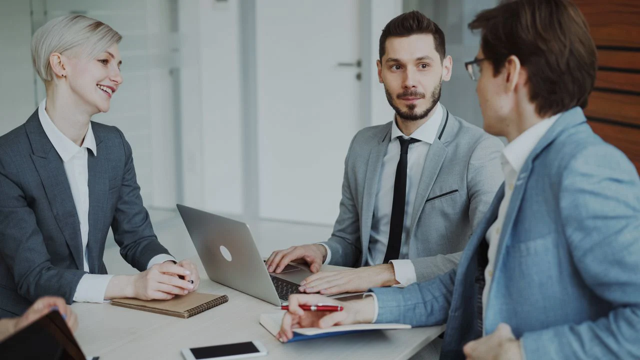 Business owner comparing SEO experts in a meeting